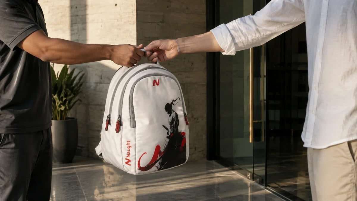 Naught service team member collecting a backpack for 24-hour doorstep repair in Delhi