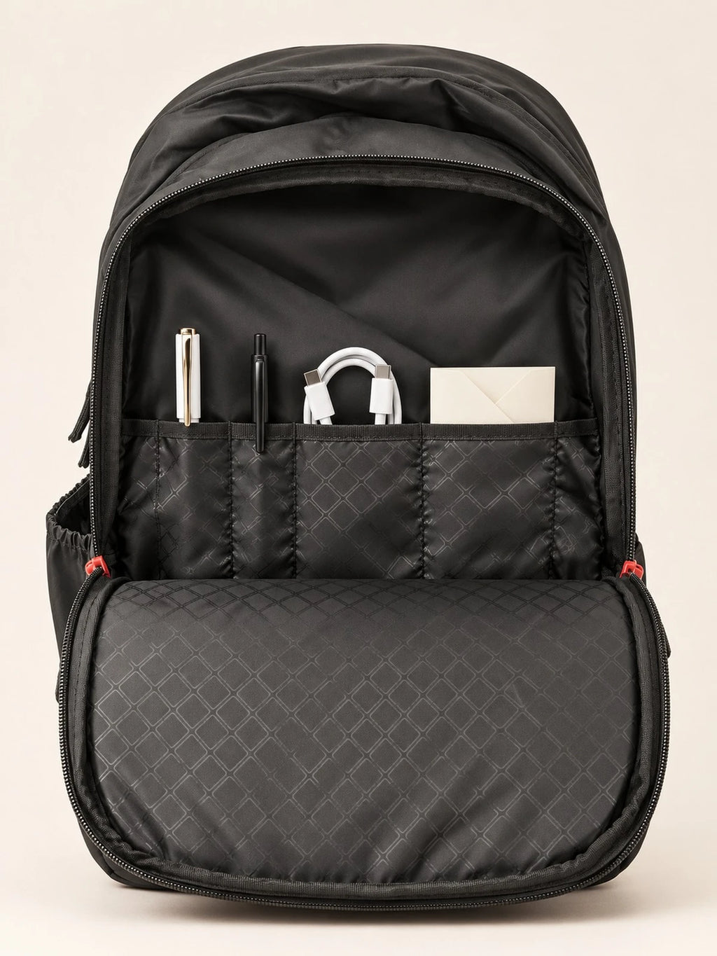 Naught backpack open, organiser pockets holding pens, cable and cards